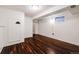 Finished basement area featuring wood laminate flooring, and bright white walls at 12780 E Bethany Pl, Aurora, CO 80014