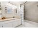 Well-appointed bathroom featuring sleek tile, contemporary fixtures, and built-in shelving at 12780 E Bethany Pl, Aurora, CO 80014