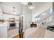 Open kitchen and dining area featuring stainless steel appliances and modern lighting at 12780 E Bethany Pl, Aurora, CO 80014