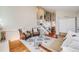 Open-concept living room leading to a dining area and a staircase to the second floor at 12780 E Bethany Pl, Aurora, CO 80014