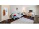 Comfortable living room with cozy seating, a bright rug, and dark hardwood floors at 12780 E Bethany Pl, Aurora, CO 80014