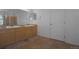 Bathroom features double sinks, tile floors, and neutral color palette at 21229 E 50Th Ave, Denver, CO 80249