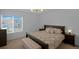 The bedroom features an inviting bed, side tables, and soft lighting at 21229 E 50Th Ave, Denver, CO 80249