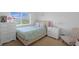 The bedroom features inviting bed, side tables, chair, dresser and soft lighting at 21229 E 50Th Ave, Denver, CO 80249