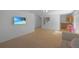 Open-concept bonus room with a kitchen, stairs, sofa and entertainment area at 21229 E 50Th Ave, Denver, CO 80249