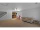 Spacious bonus room featuring stairs, a sofa and entertainment area at 21229 E 50Th Ave, Denver, CO 80249