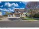 Charming two-story home with a three-car garage, inviting curb appeal, and beautiful landscaping at 21229 E 50Th Ave, Denver, CO 80249