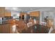 Spacious kitchen featuring stainless steel appliances, granite countertops, and an island at 21229 E 50Th Ave, Denver, CO 80249