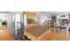 Modern kitchen boasts stainless steel appliances and opens to a large living area at 21229 E 50Th Ave, Denver, CO 80249