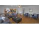 Spacious living room with hardwood floors, large windows, and an open layout at 21229 E 50Th Ave, Denver, CO 80249