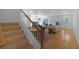 Bright living area showcasing a staircase, fireplace, dining area and natural light at 21229 E 50Th Ave, Denver, CO 80249