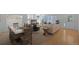 Well-lit living room with a fireplace, dining area, and open layout at 21229 E 50Th Ave, Denver, CO 80249