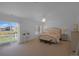 Serene main bedroom featuring a private balcony, soft color palette and carpeted floor at 21229 E 50Th Ave, Denver, CO 80249