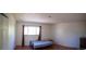 Bright bedroom with a large window and laminate flooring at 1509 S Lewiston St, Aurora, CO 80017