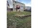 Large backyard with a deck, wood retaining wall, and space for outdoor activities at 4064 S Himalaya Way, Aurora, CO 80013