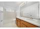 Bathroom featuring a double vanity, and bathtub with shower at 4064 S Himalaya Way, Aurora, CO 80013