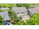 Two-story home with neutral siding, gray roof, attached garage and mature landscaping at 4064 S Himalaya Way, Aurora, CO 80013