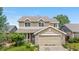 Two-story home with a two-car garage and a well-kept lawn in a suburban neighborhood at 4064 S Himalaya Way, Aurora, CO 80013