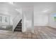 Hallway showcasing tile flooring and natural light, providing a seamless transition and a bright and welcoming atmosphere at 4064 S Himalaya Way, Aurora, CO 80013