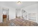 Spacious hallway and staircase showcasing a smooth transition between rooms with tile flooring and neutral walls at 4064 S Himalaya Way, Aurora, CO 80013