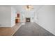 Living room with a brick fireplace, soft carpet, and natural light, adjacent to kitchen and patio access at 4064 S Himalaya Way, Aurora, CO 80013
