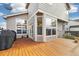 Beautiful wood back deck overlooks the yard and features sliding glass doors leading indoors for easy access at 3305 W 126Th Ave, Broomfield, CO 80020