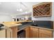 Charming basement bar area is equipped with a sink, wine rack, and countertop space for beverages at 3305 W 126Th Ave, Broomfield, CO 80020