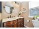 Cozy bathroom with marble vanity, custom cabinets, and natural light at 3305 W 126Th Ave, Broomfield, CO 80020