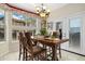 Inviting dining area with a bay window, pendant lighting, and convenient access to the outdoor space at 3305 W 126Th Ave, Broomfield, CO 80020
