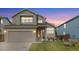 Charming two-story home with a well-manicured lawn, covered entryway, and attached two-car garage at 3305 W 126Th Ave, Broomfield, CO 80020