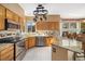 Modern kitchen with a breakfast bar, stainless steel appliances, and ample counter space for cooking at 3305 W 126Th Ave, Broomfield, CO 80020