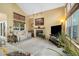 Bright living room with a cozy fireplace, comfortable seating, and large windows offering plenty of natural light at 3305 W 126Th Ave, Broomfield, CO 80020