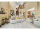 Spacious living room with neutral tones, seamlessly connected to the staircase, kitchen, and dining area at 3305 W 126Th Ave, Broomfield, CO 80020