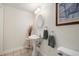 Cozy powder room with pedestal sink and decorative accents, offers both functionality and understated elegance at 3305 W 126Th Ave, Broomfield, CO 80020