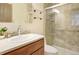 Bright bathroom with glass enclosed shower and vanity with ample countertop space at 6505 Kalua Rd # 104B, Boulder, CO 80301