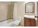 Bathroom features a vanity, toilet and tiled shower with a shower curtain at 6505 Kalua Rd # 104B, Boulder, CO 80301