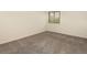 Bedroom featuring neutral walls and carpet, and a bright window at 6505 Kalua Rd # 104B, Boulder, CO 80301