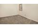 This cozy bedroom features neutral carpet and a window providing natural light at 6505 Kalua Rd # 104B, Boulder, CO 80301