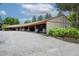 Covered carport for residents with ample parking spots and greenery at 6505 Kalua Rd # 104B, Boulder, CO 80301