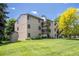 Exterior building view of the apartment complex with individual private balconies and a storage shed at 6505 Kalua Rd # 104B, Boulder, CO 80301
