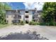 Multi-Gathering residential building featuring balconies, neutral exterior, and manicured landscaping at 6505 Kalua Rd # 104B, Boulder, CO 80301