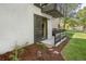 Cozy ground floor patio with wooden fence, stone pavers and mulch landscaping on a sunny day at 6505 Kalua Rd # 104B, Boulder, CO 80301