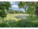Scenic view of a green algae-covered pond framed by lush trees and vegetation at 6505 Kalua Rd # 104B, Boulder, CO 80301