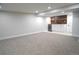Spacious finished basement featuring a beverage bar, carpet flooring, and recessed lighting at 815 S Jersey St, Denver, CO 80224