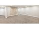 This spacious basement has neutral carpet, modern wood trim, and recessed lighting at 815 S Jersey St, Denver, CO 80224