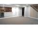 Finished basement featuring a bar area with wine cooler, cabinets, and wood accent wall at 815 S Jersey St, Denver, CO 80224