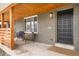 Charming covered front porch with seating, creating a welcoming entrance to the home at 815 S Jersey St, Denver, CO 80224