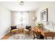 Bright home office featuring stylish desk, chairs, and natural light creating a workspace at 815 S Jersey St, Denver, CO 80224