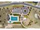 Aerial view showcases the community pool, playground, parking, walking paths, landscaping, and nearby street access at 12214 Stone Timber Ct, Parker, CO 80134