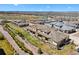 Aerial view of community showcasing well-maintained townhomes, walking trails, landscaping, and mountain views in the distance at 12214 Stone Timber Ct, Parker, CO 80134